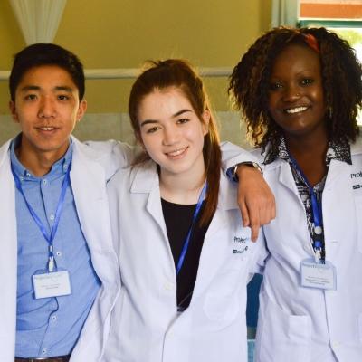 Projects Abroad interns taking a photo with local doctors whilst on their nursing placement in Kenya. Interns from Projects Abroad take a photo with local doctors whilst on their nursing work experience in Kenya.